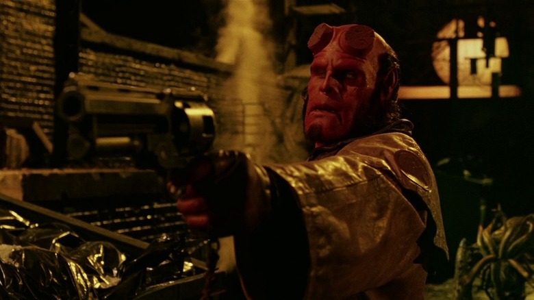 Hellboy aims gun