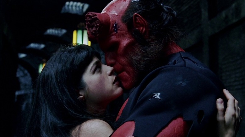 Hellboy holds Liz