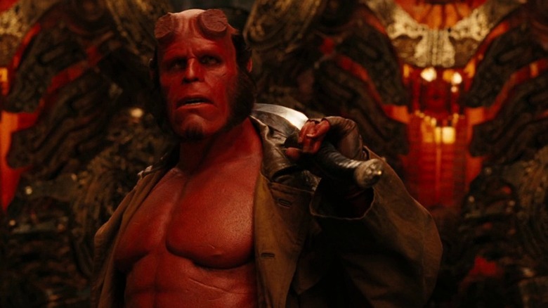 Hellboy holds sword