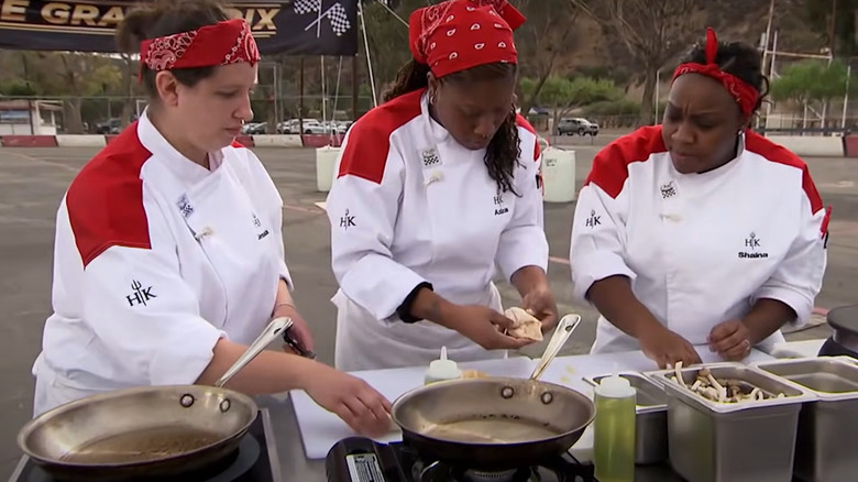 Three chefs cooking outside