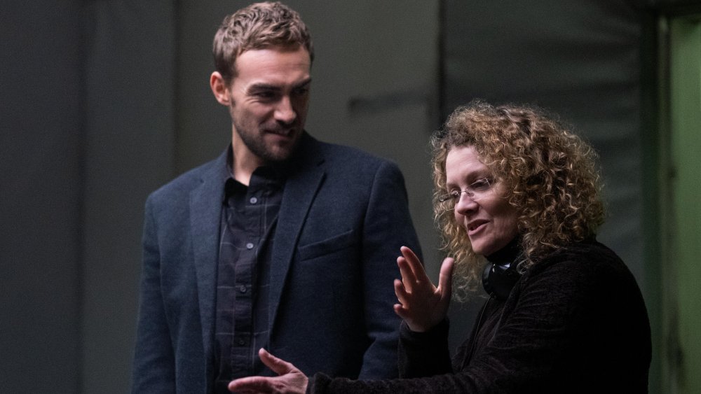 Tom Austen with director Daina Reid on the set of Helstrom