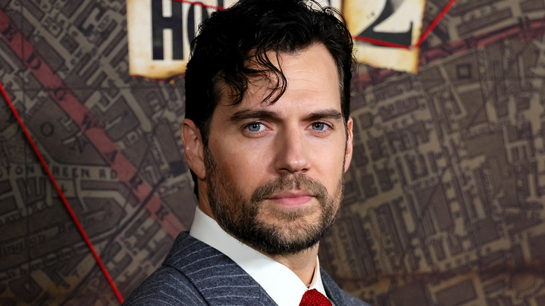 Henry Cavill red tie pinstripe suit