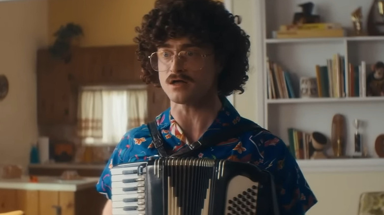 Weird Al playing an accordion