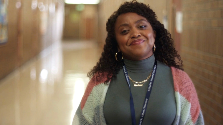 Quinta Brunson standing in school hallway