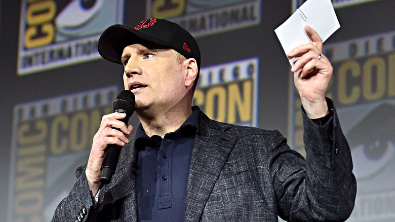 Kevin Feige holding up note card