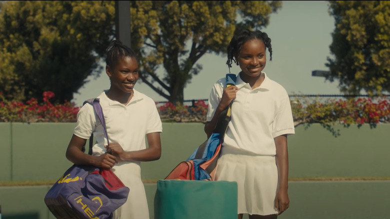 Young Serena and Venus with gym bags