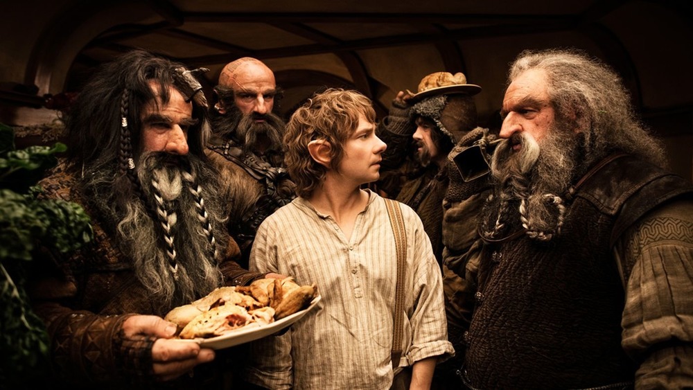 Bilbo Baggins surrounded by dwarves