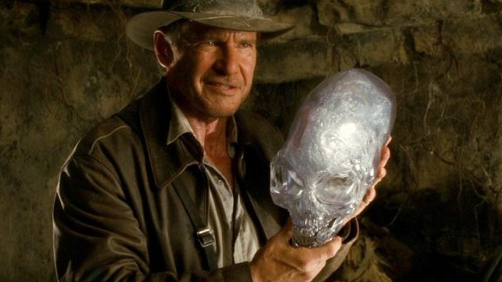 Indiana Jones holding a crystal skull