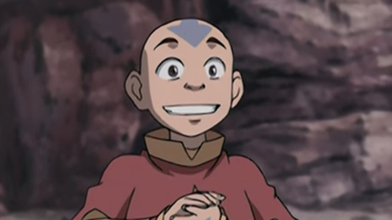 Aang smiling and clapping