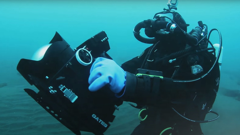 Cameraman filming underwater