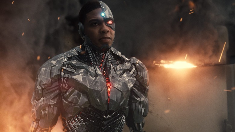 Cyborg standing in front of explosion