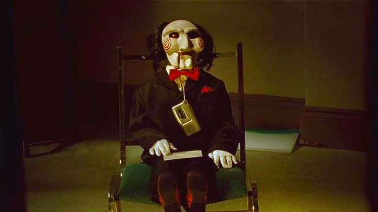 Billy the Puppet propped up on a chair