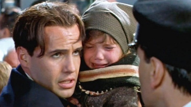 Billy Zane holding crying child in "Titanic"