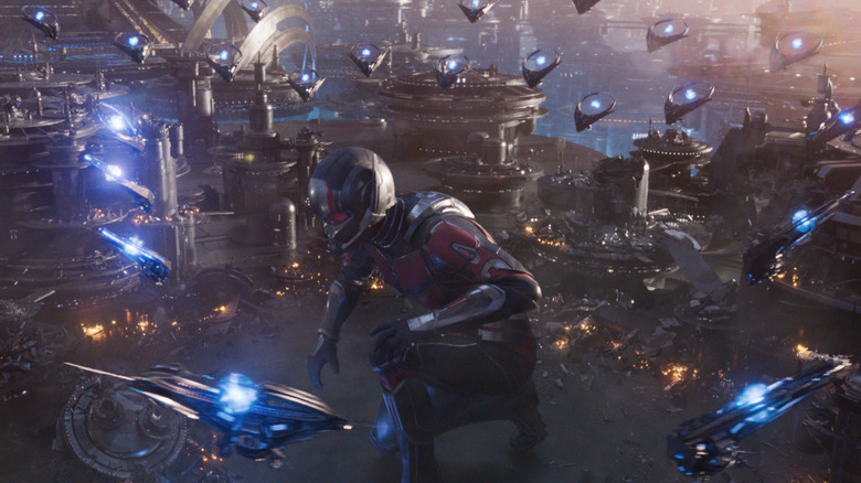 Ant-Man crouching with flying ships circling 