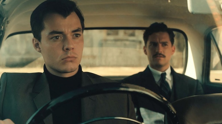 Alfred Pennyworth driving Thomas Wayne