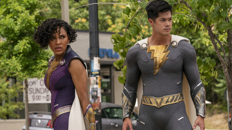 Darla and Eugene in Shazam suits outside 