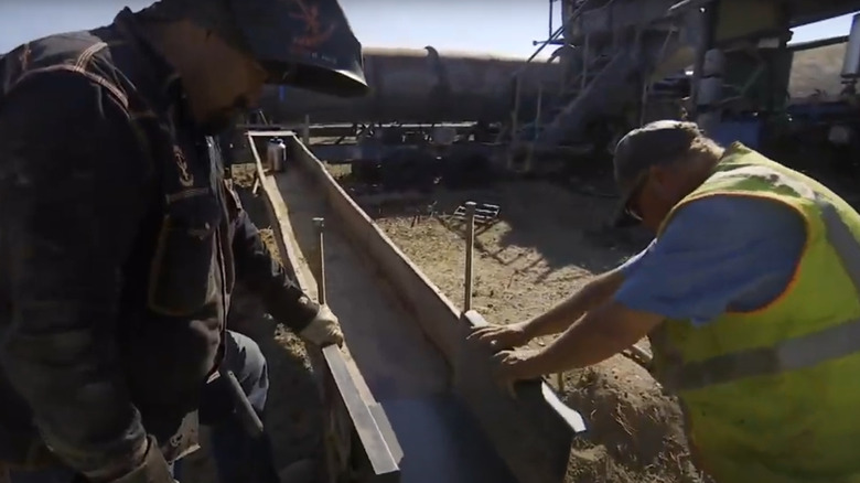 Freddy Dodge helping a miner