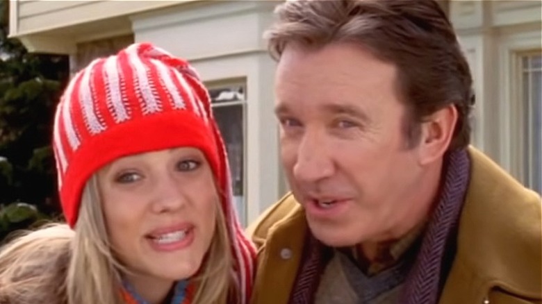 Tim Allen and Julie Gonzalo look at camera