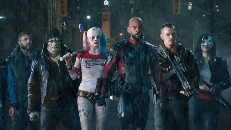 The Suicide Squad walking in the rain