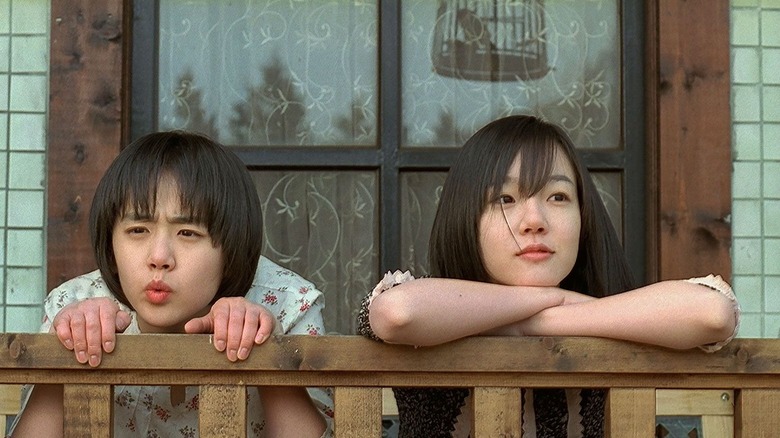 Moon Geun-young and Im Soo-Jung  on rail in A Tale of Two Sisters