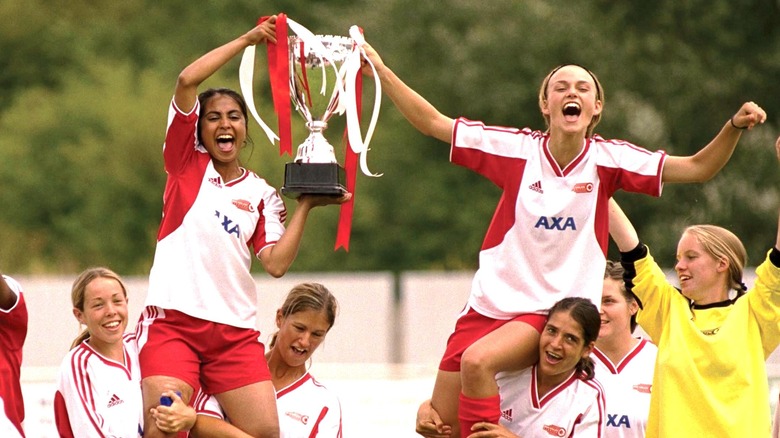 Jess and Jules holding trophy