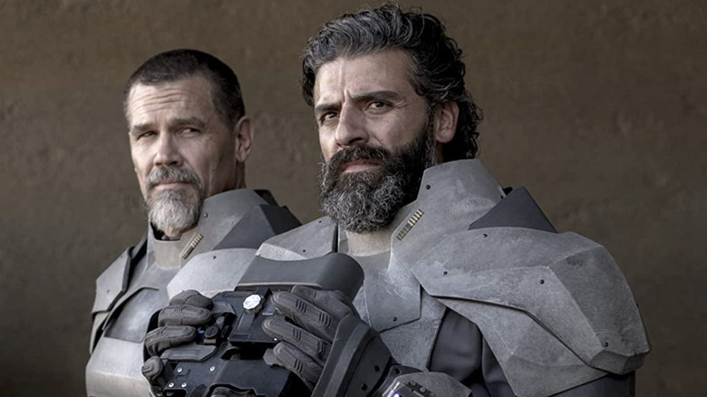 Oscar Isaac, Josh Brolin wearing gray armor