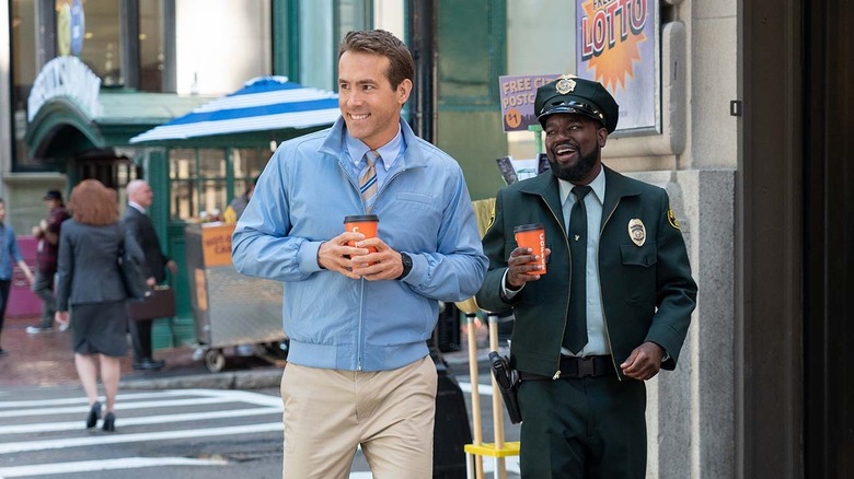 Ryan Reynolds and Lil Rel Howery walking with coffee