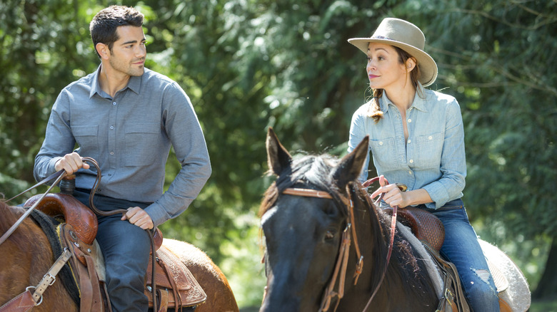 Bradley and Sarah riding horses 