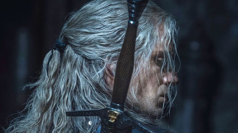 Geralt looking backward with sword