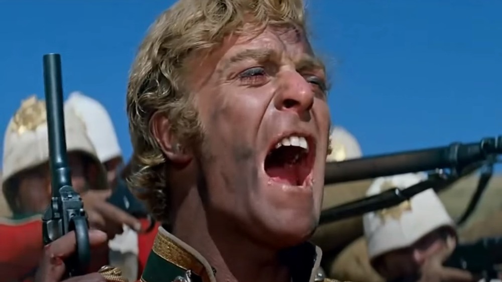 Michael Caine shouting with a gun