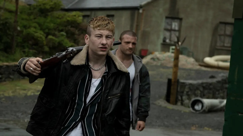 Barry Keoghan in leather jacket with gun