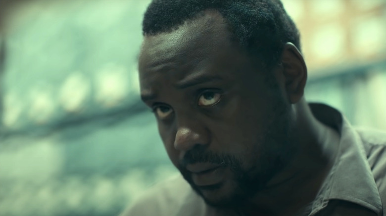 Brian Tyree Henry behind glass in Joker