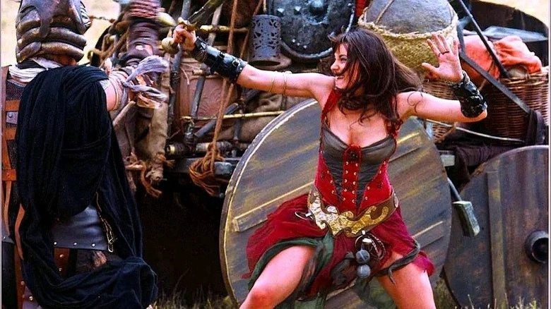 Xena fighting in red dress