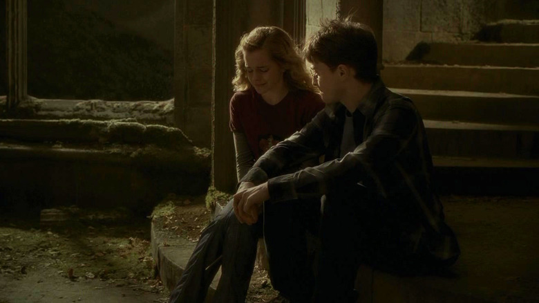 Harry comforting crying Hermione