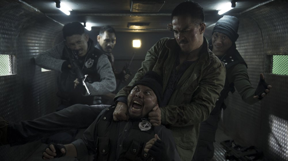 Joe Taslim strangles a man in The Night Comes for Us