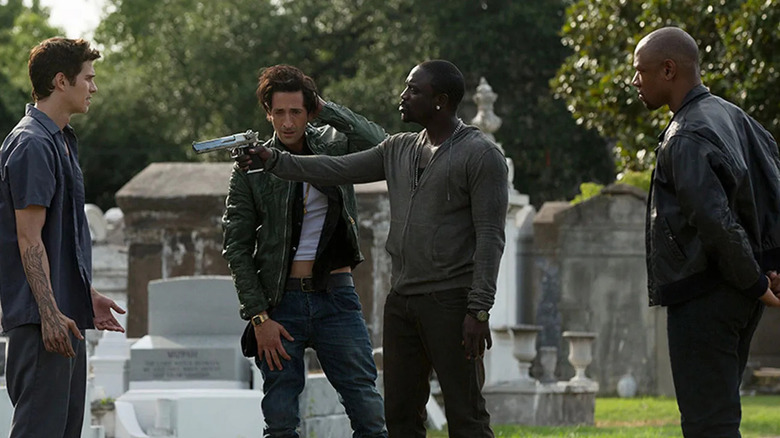 Man gathered cemetery with gun