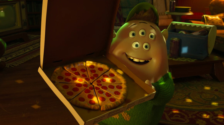 Squishy Smiling and Holding Pizza