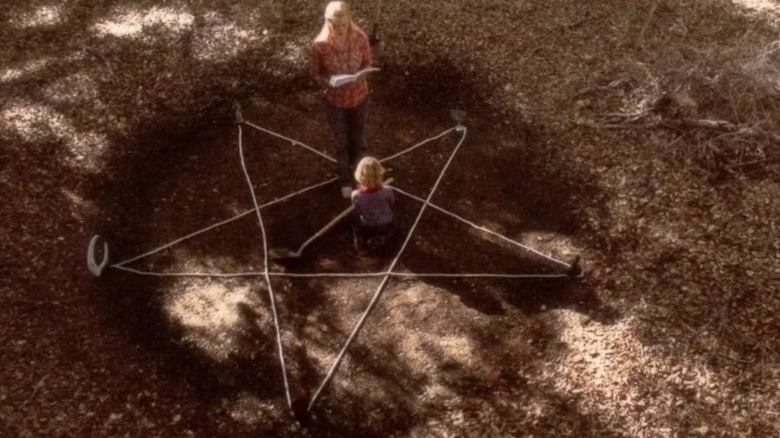 Oralee and Nathan make a pentagram