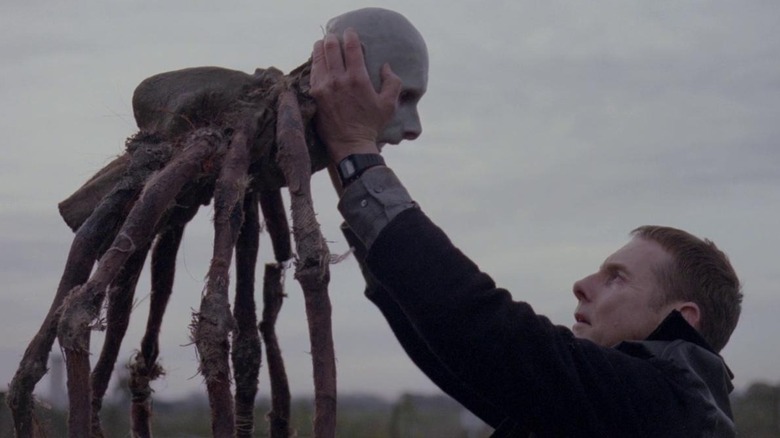 Philip holds up Possum