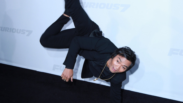 Tony Jaa doing acrobatics at movie premiere