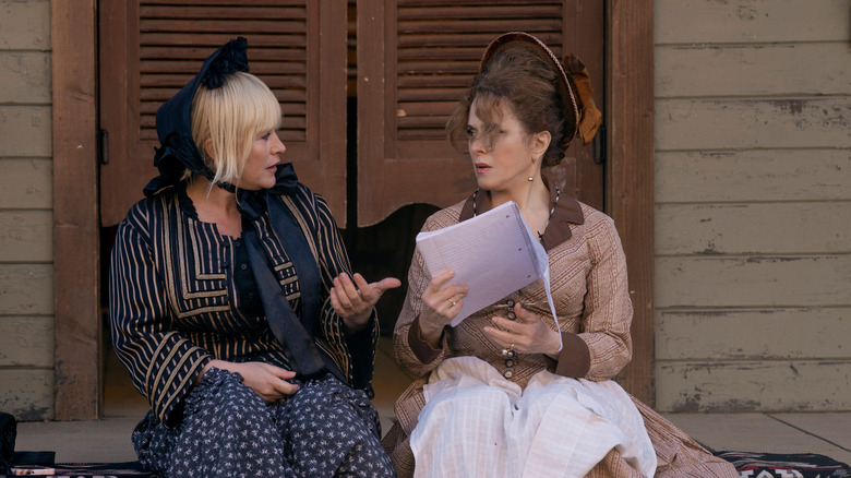 Peggy and Roslyn sitting in pioneer garb