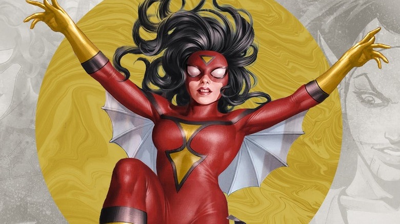 Spider-Woman raises her arms