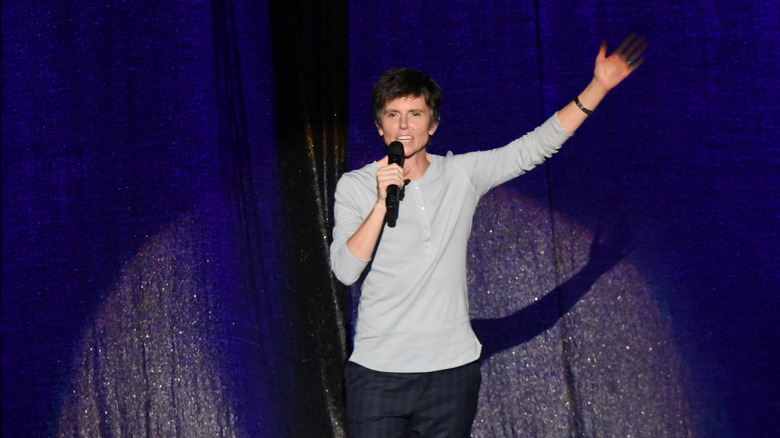 Tig Notaro waving onstage