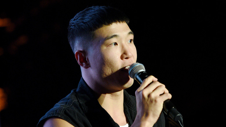 Joel Kim Booster onstage