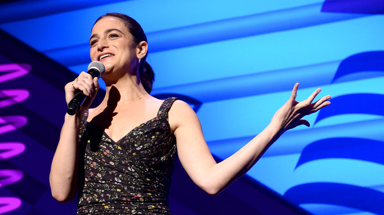 Jenny Slate onstage with microphone