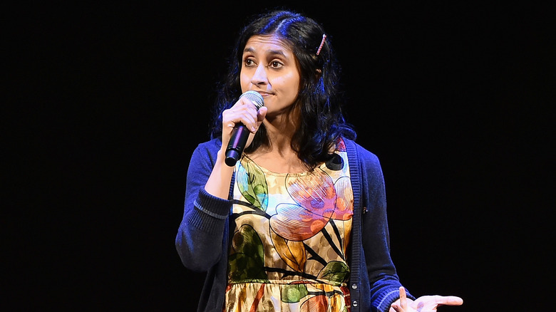 Aparna Nancherla with a microphone