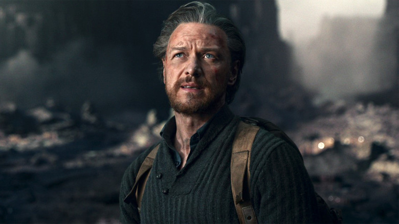 James McAvoy as Lord Asriel standing in ruins