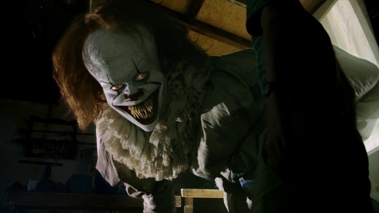 Pennywise smiling with big sharp teeth