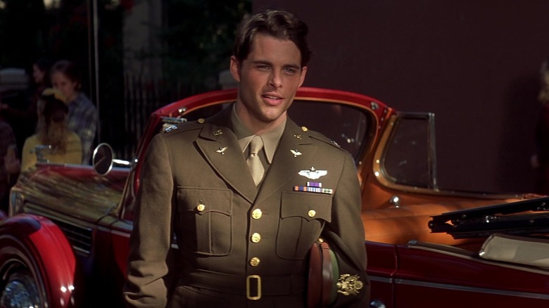 Lon in Army uniform by car