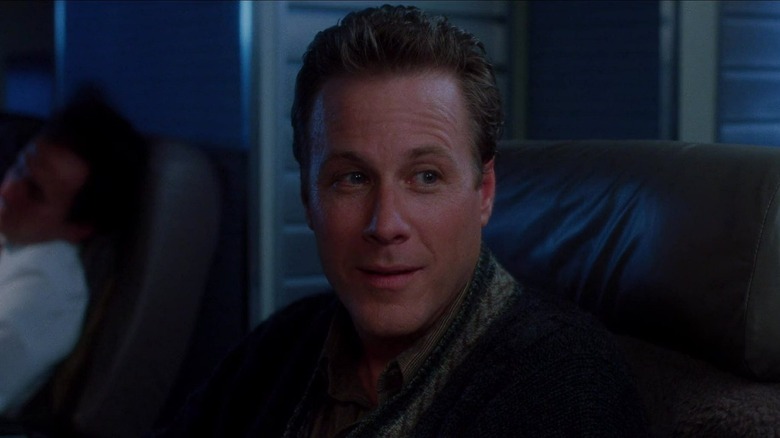 Peter McCallister smiling on plane